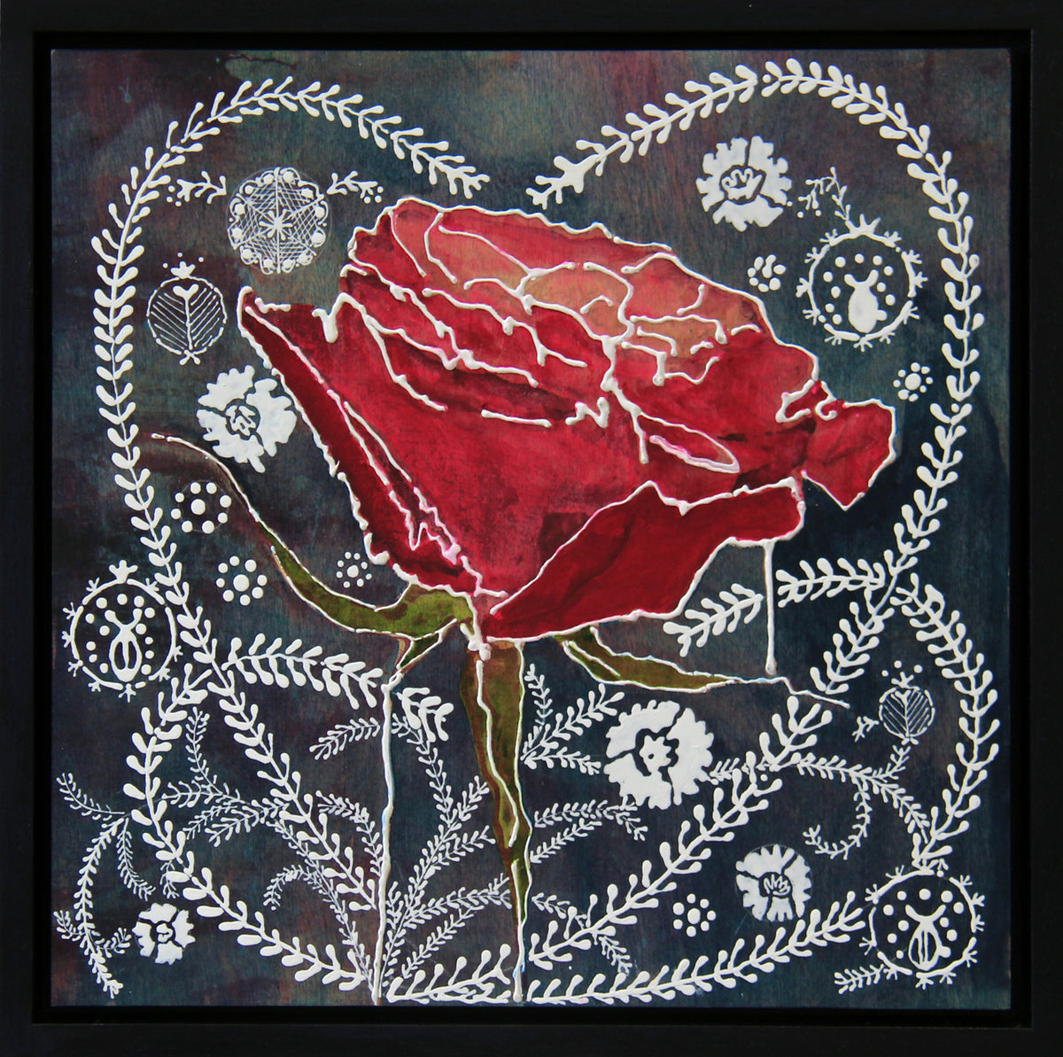 A framed square art print featuring a large red rose in the center, surrounded by white floral and leafy motifs on a dark textured background.