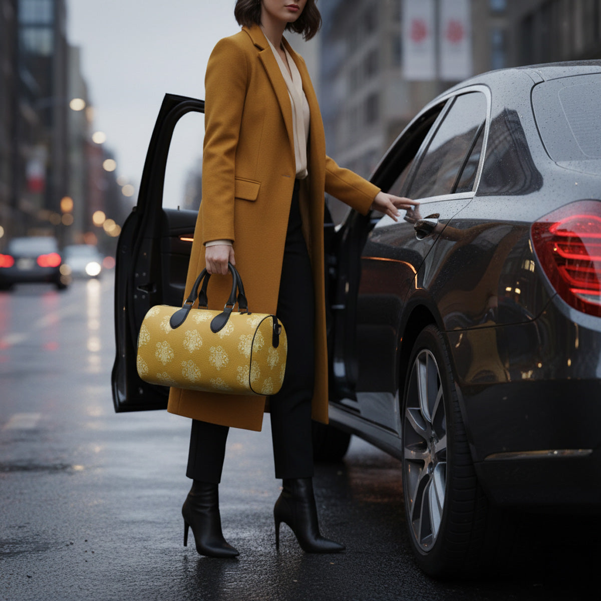Woman holding a Mustard yellow leather duffle travel bag with white damask pattern.