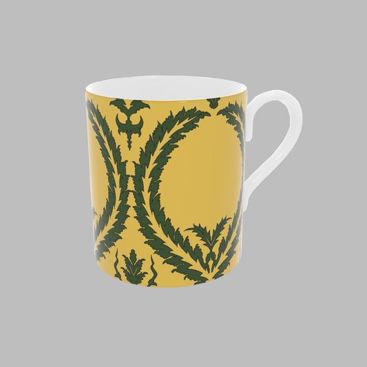 Yellow bone china Mug with green wreath pattern.