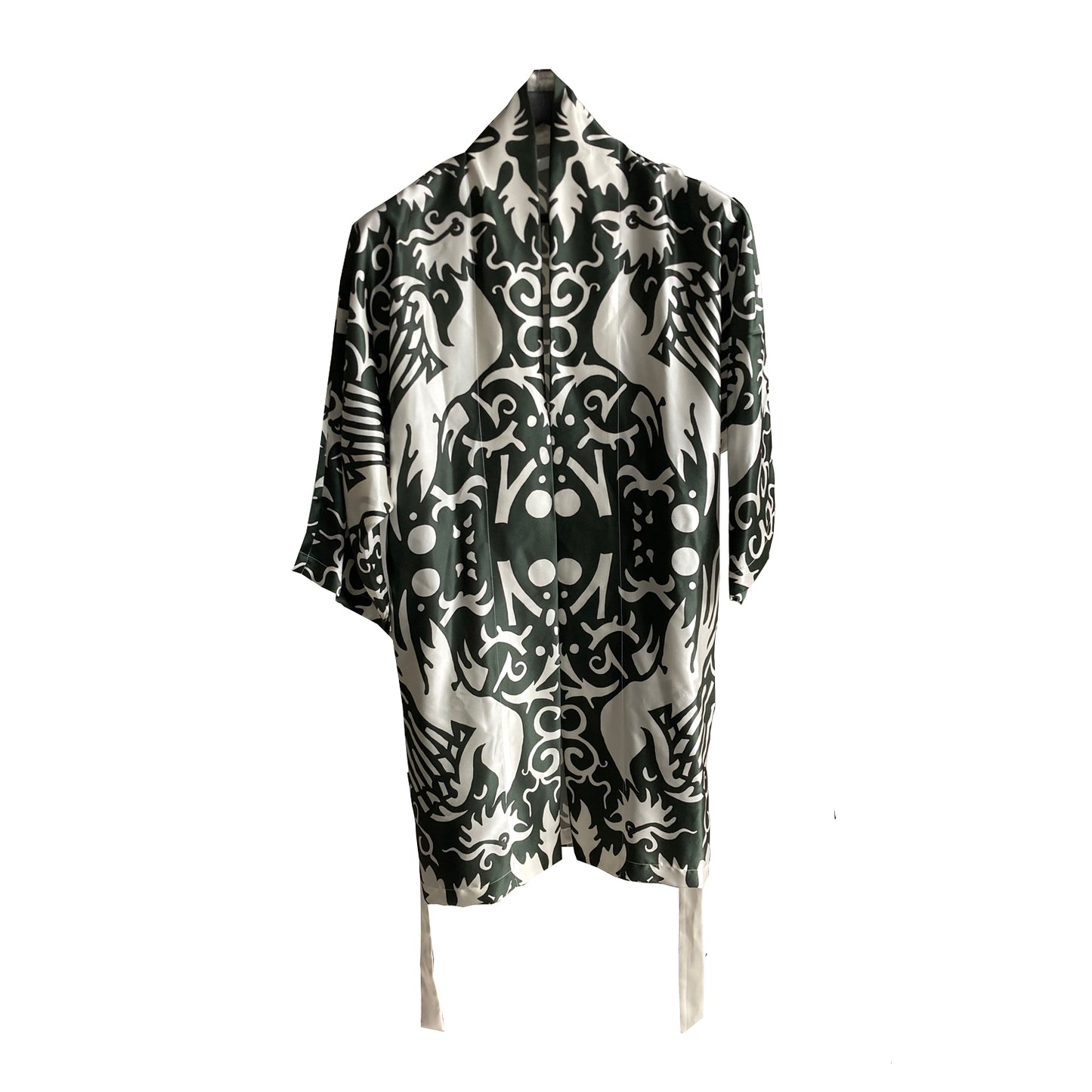 A silk kimono with a white phoenix pattern on a green background.