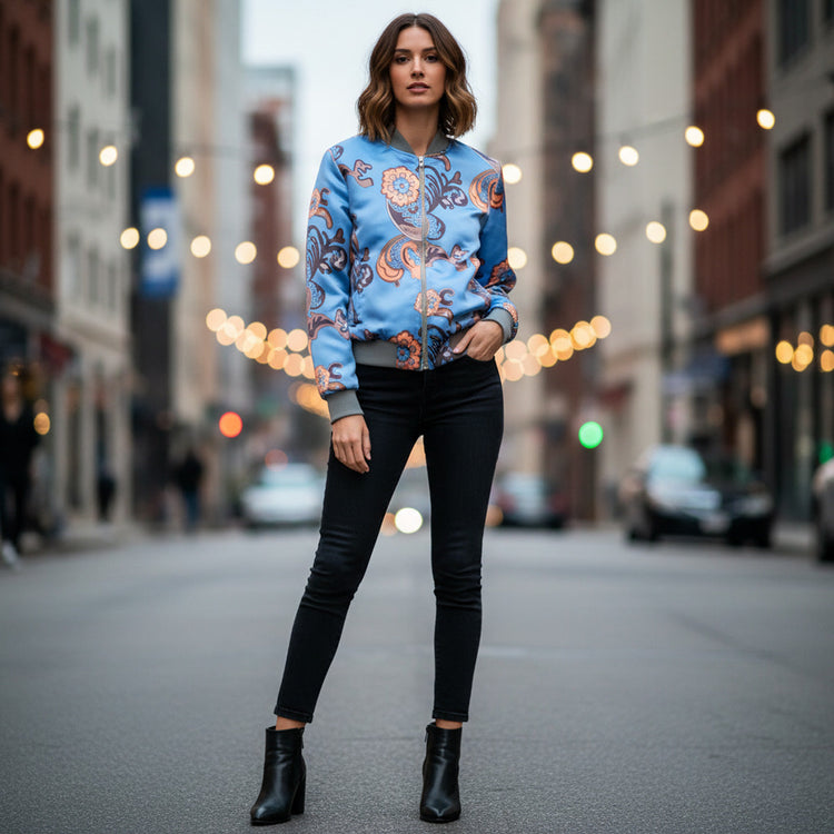 Blue satin bomber jacker with tan and orage lace pattern andgrey jersey trim