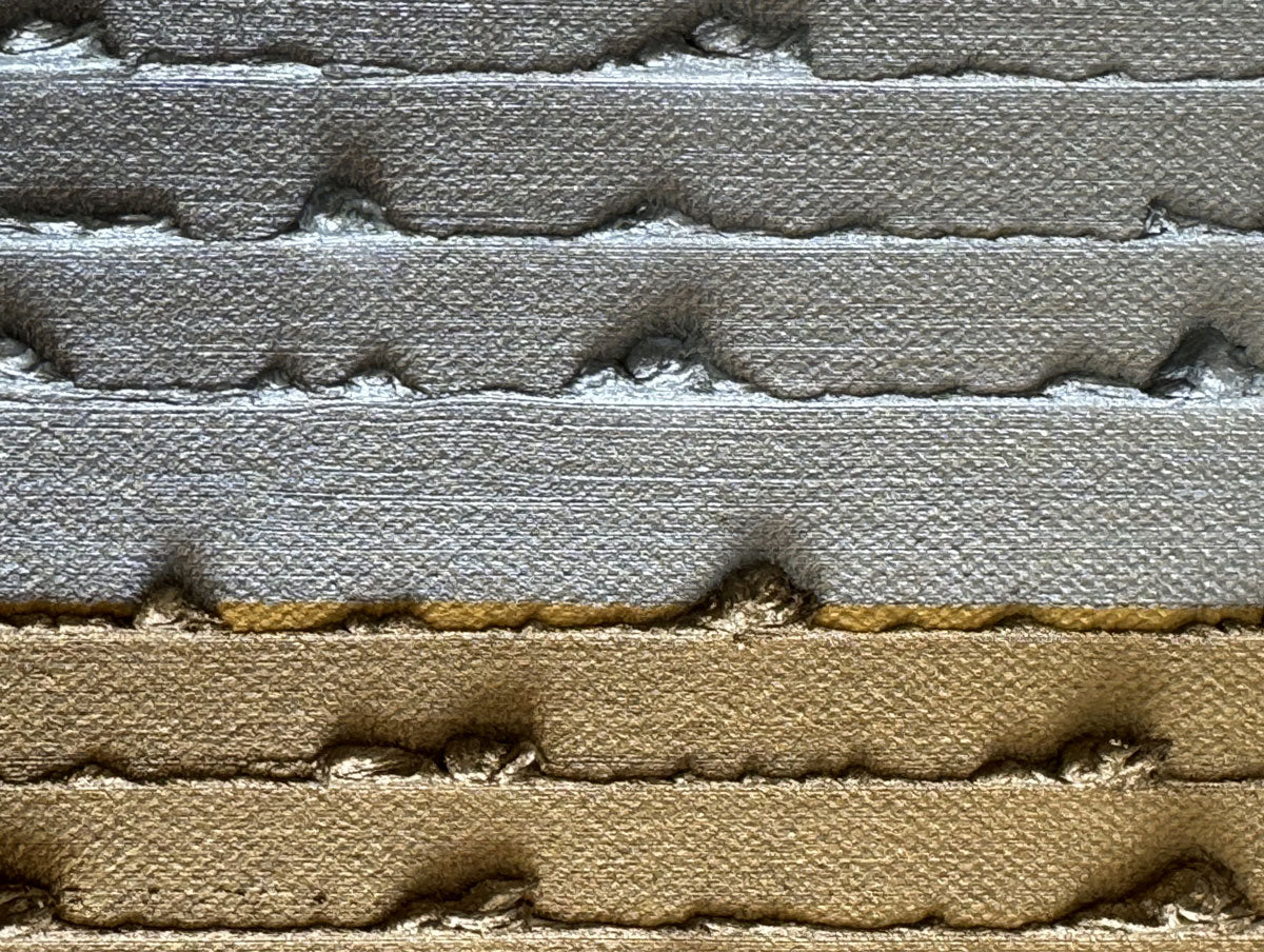 Close-up of a small gold striped square canvas oil painting with gold leaf.