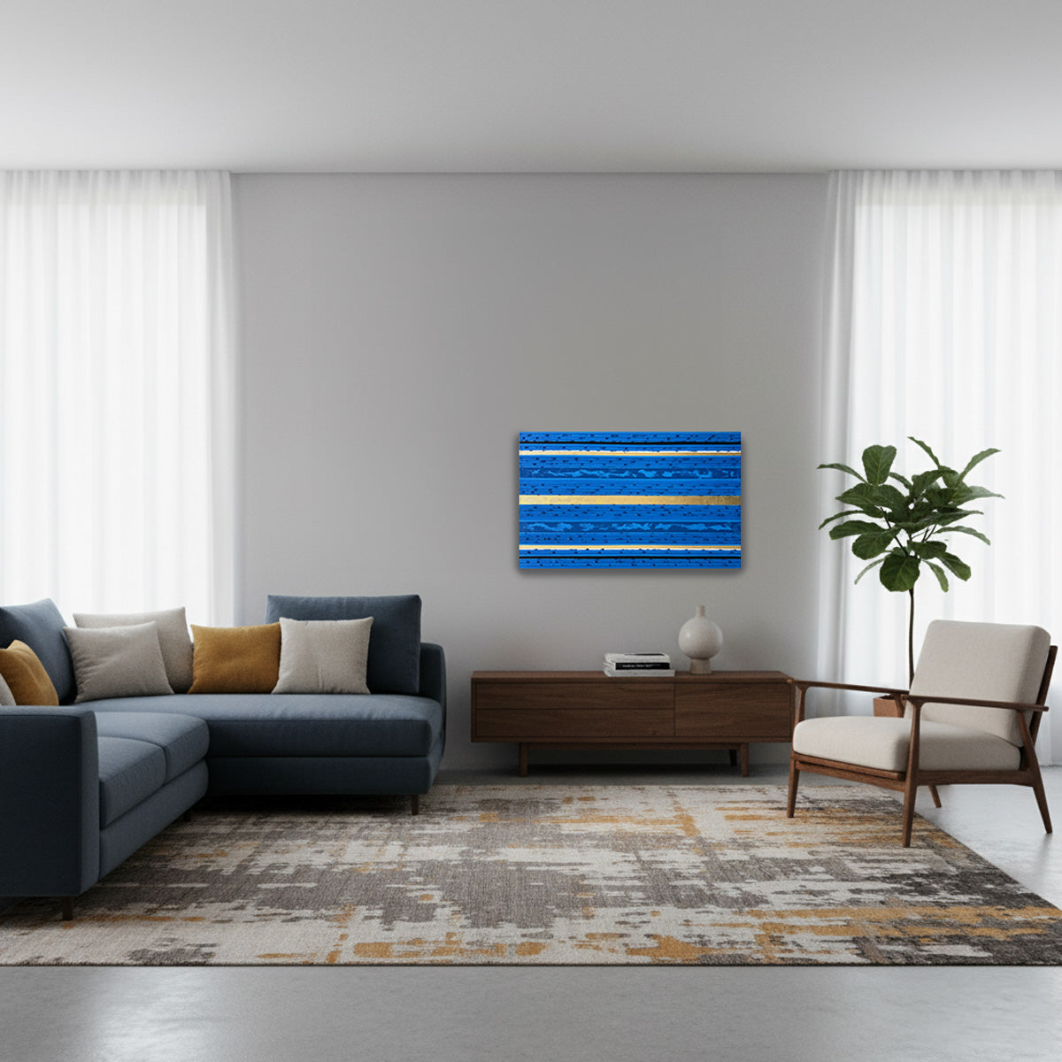 A modern living room with a blue sectional sofa, a wooden sideboard, a beige armchair, a patterned area rug, and a blue and gold abstract stripes canvas oil painting on the wall.