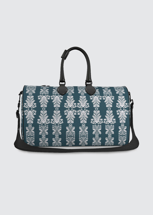Teal blue duffel bag with white floral damask pattern 