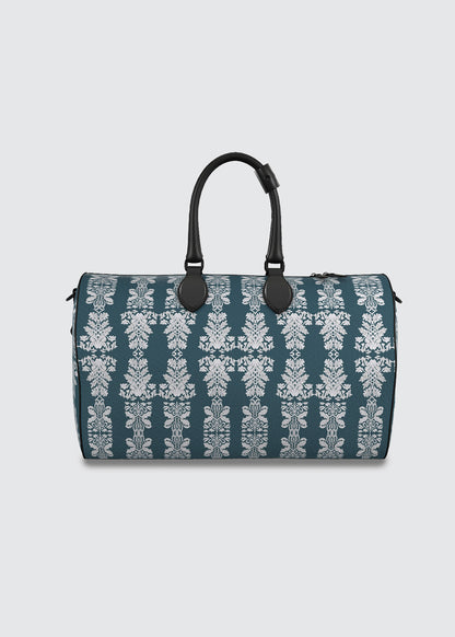 Teal blue duffel bag with white floral damask pattern