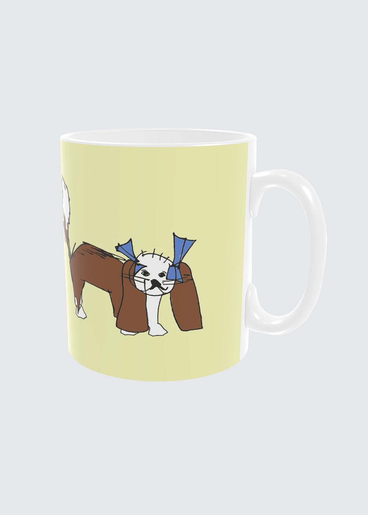 Mug with a King Charles Cavalier dog design on a light yellow background.