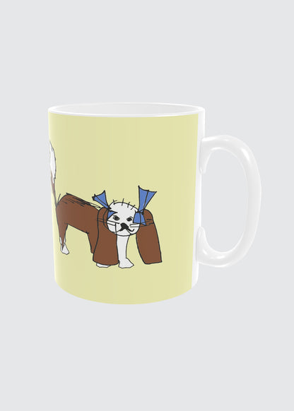 Mug with a King Charles Cavalier dog design on a light yellow background.