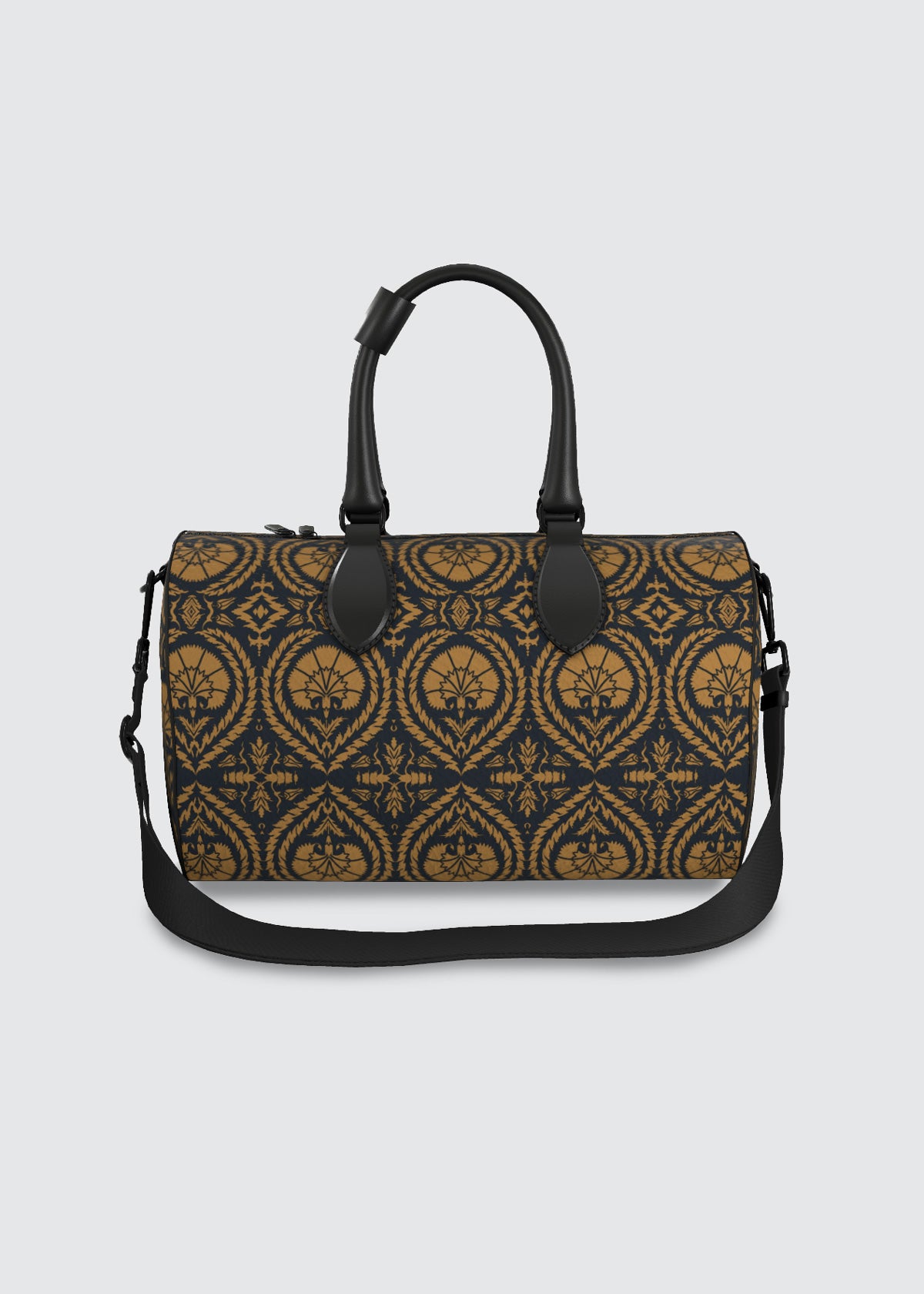 A structured duffel bag with a dark navy blue and ochre damask pattern, featuring black leather handles and a matching black shoulder strap, set against a solid light gray background.