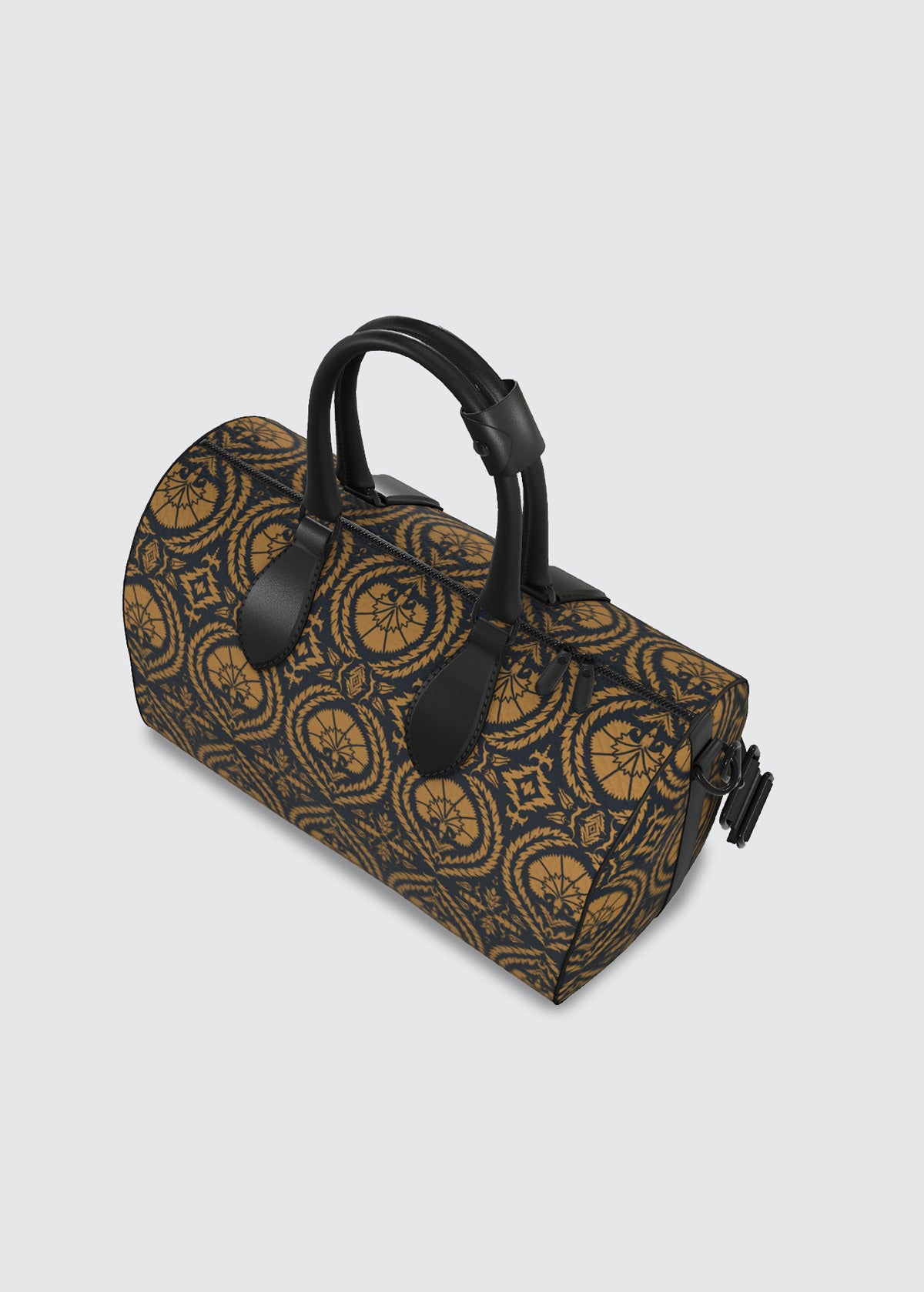 A cylindrical duffel bag with a navy and brown ochre geometric acanthus and wreath pattern, featuring black leather handles and trim, photographed on a light gray background.