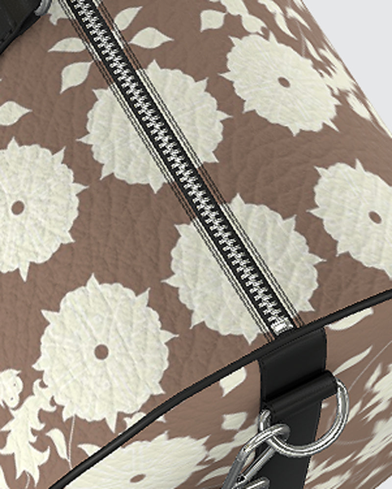 Detail of Duffle bag with white floral pattern on mocha background