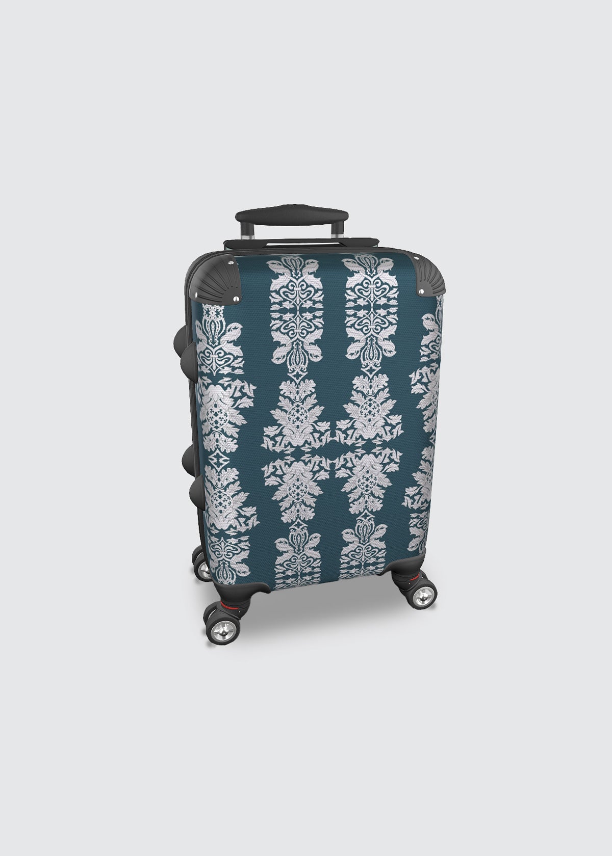Teal carry-on suitcase with white damask pattern.