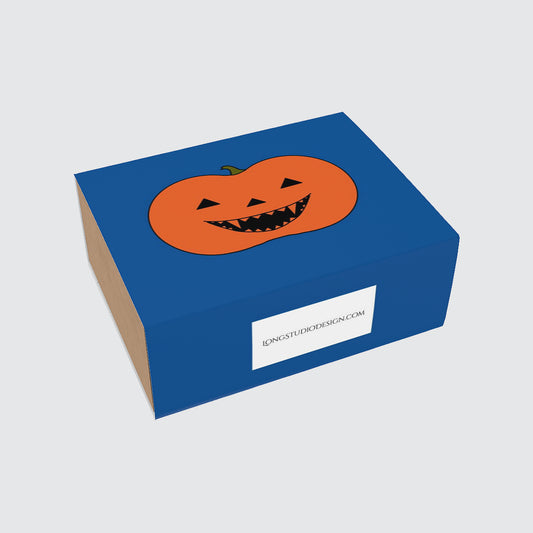 Blue gift box with a pumpkin design on a light gray background