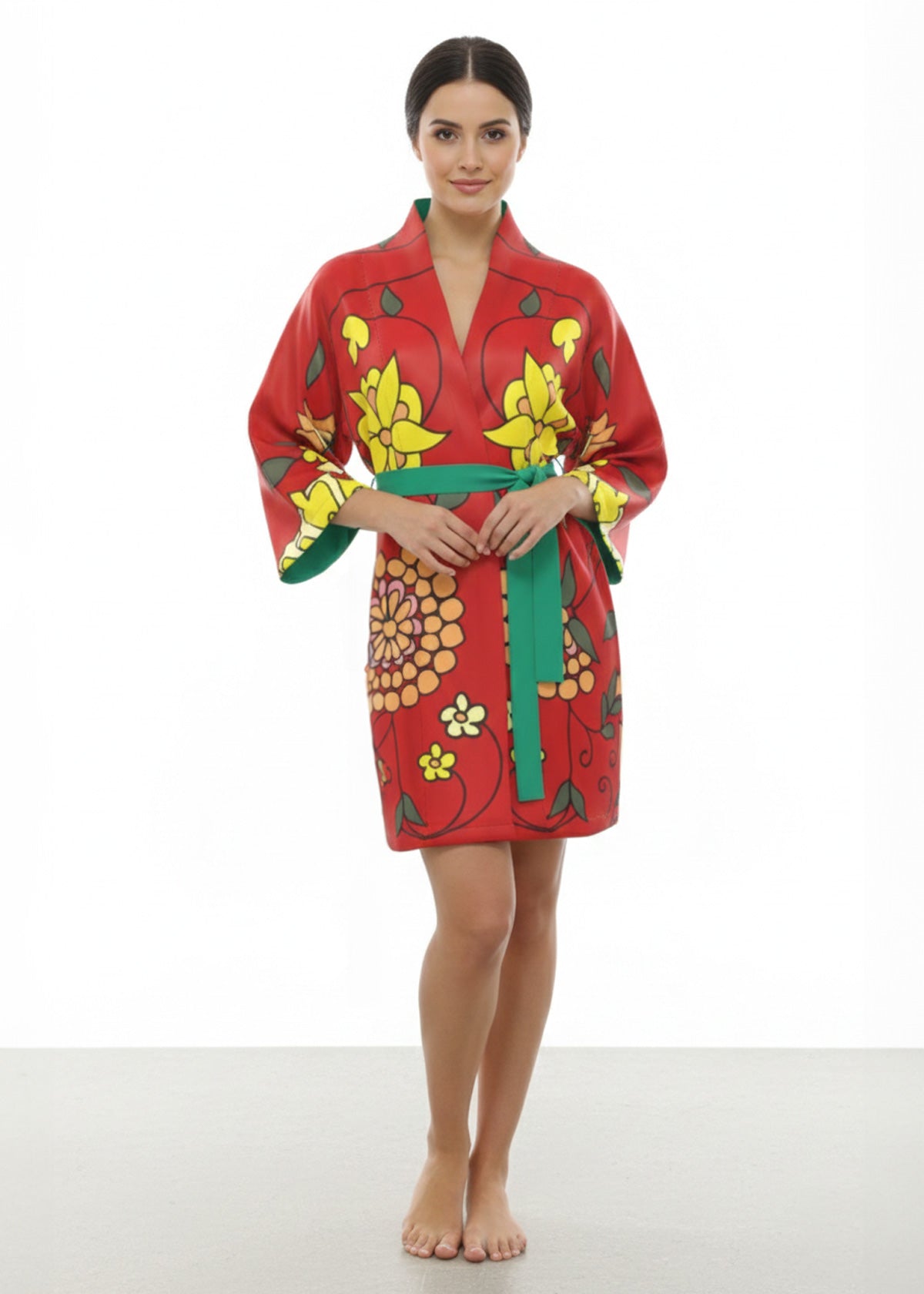 Woman wearing a red floral-patterned silk kimono robe on a white background