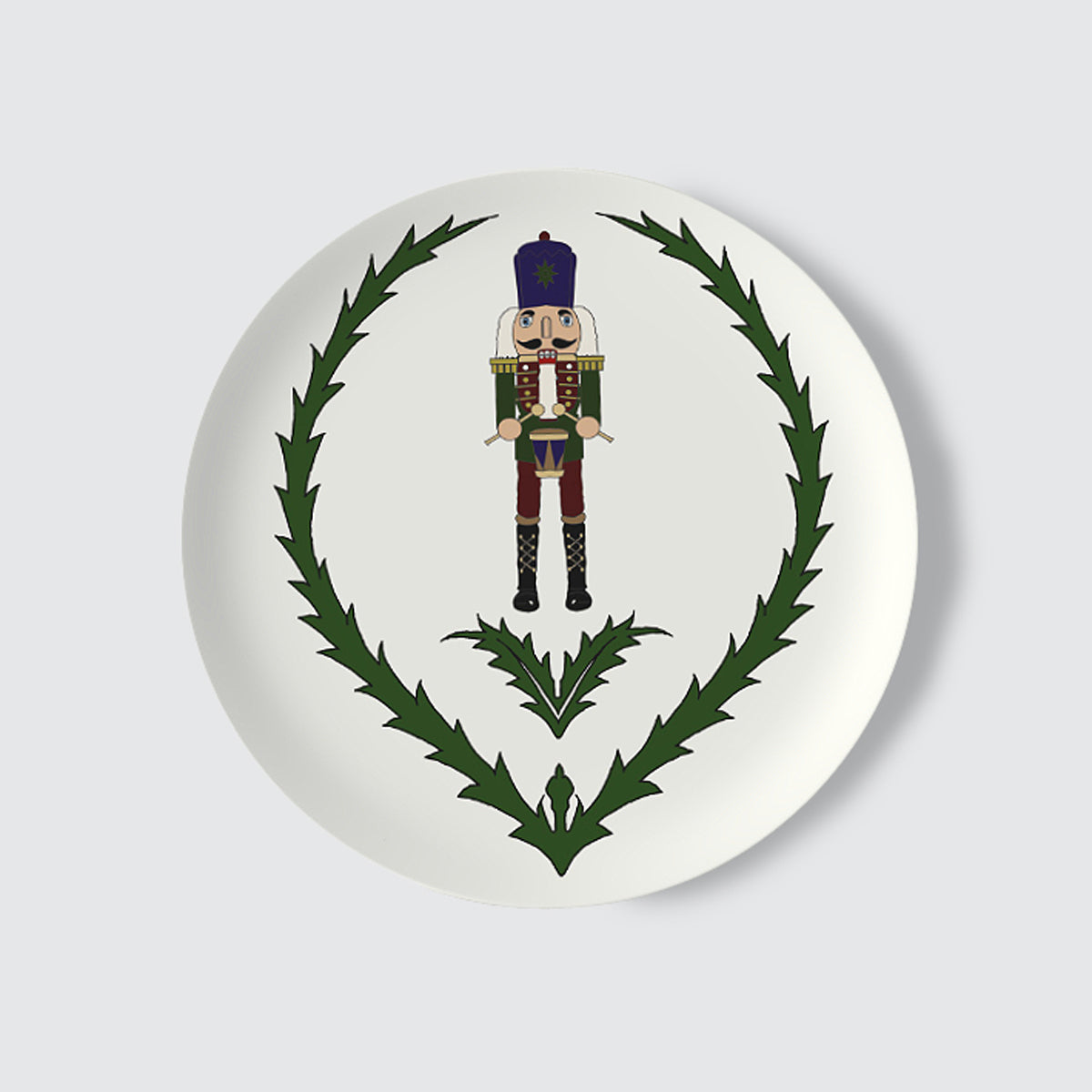 Decorative plate with a nutcracker and thistle design on a white background