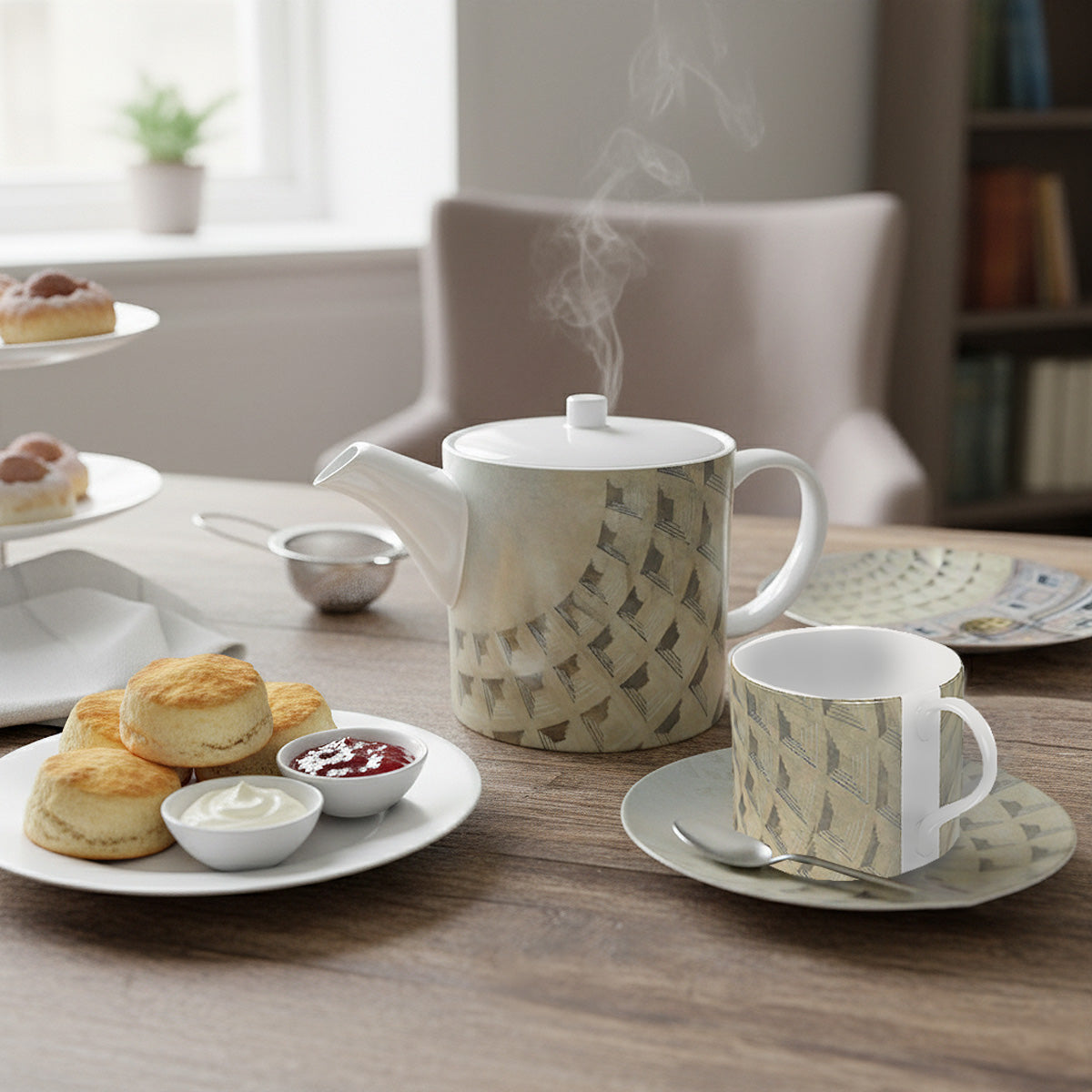 Tea set of the Pantheon Dome design with teapot, cup, and biscuits on a wooden table.