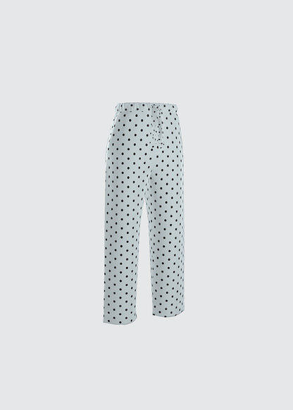 Pale seafoam blue with black Polka dot pyjama bottoms.