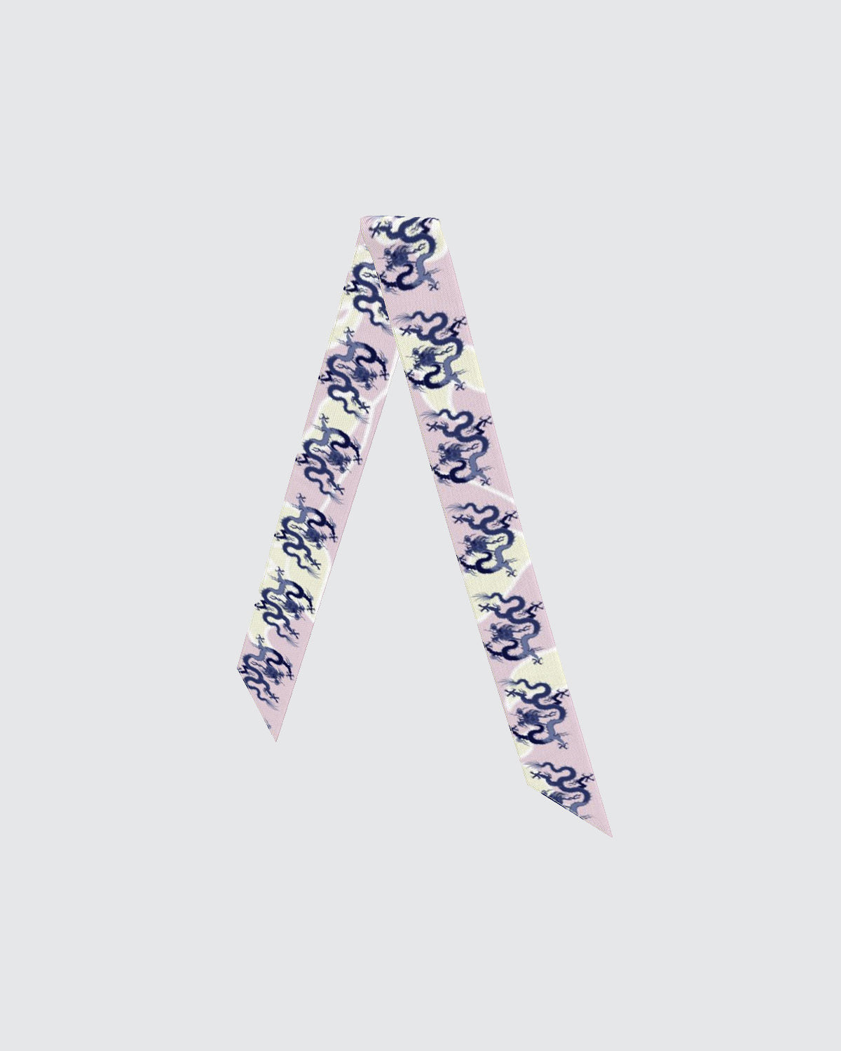 Skinny hair silk scarf with blue dragons on a pink and cream background.