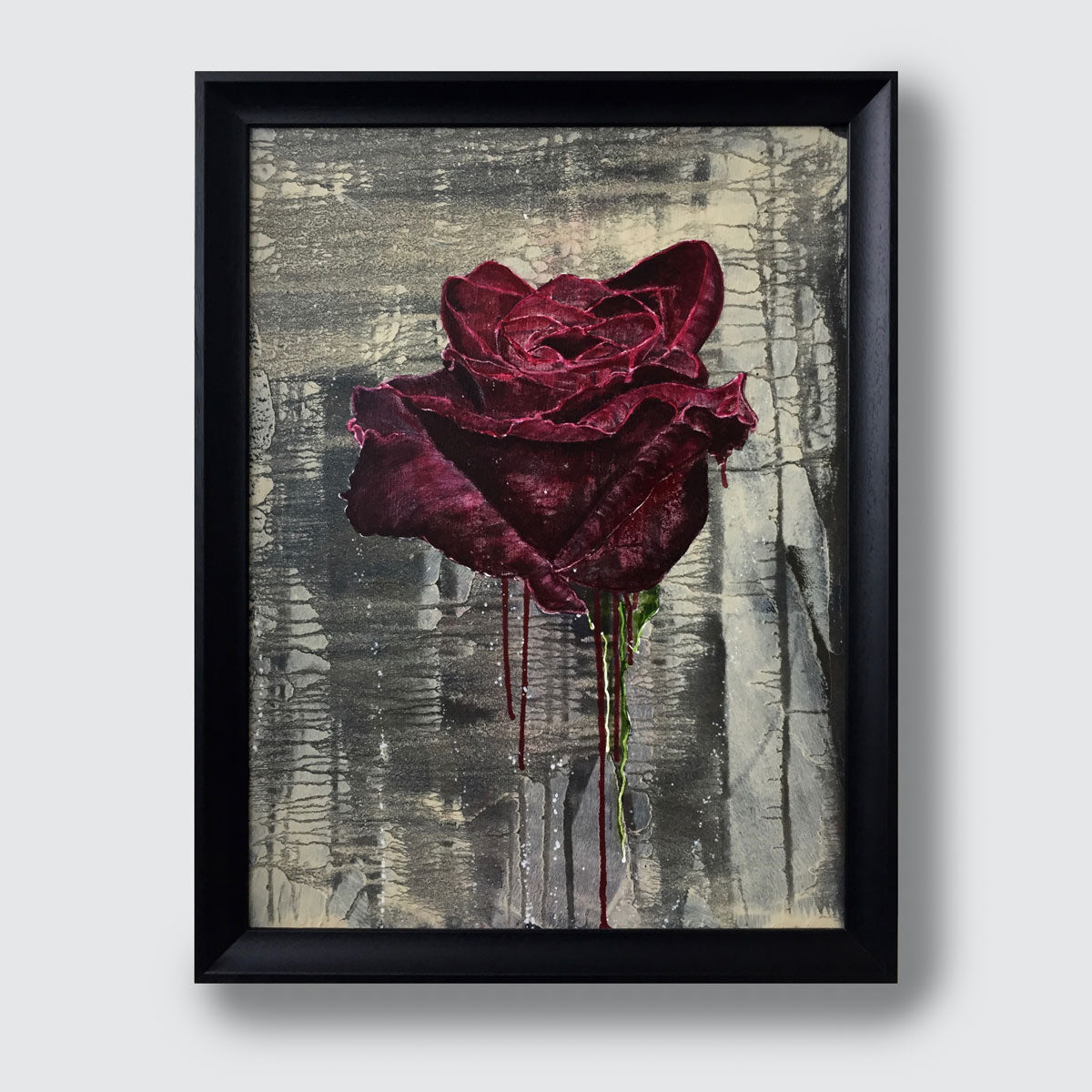 A framed original acrylic painting featuring a textured, crimson rose dripping with red paint against a distressed gray and beige background, enclosed in a simple black frame.