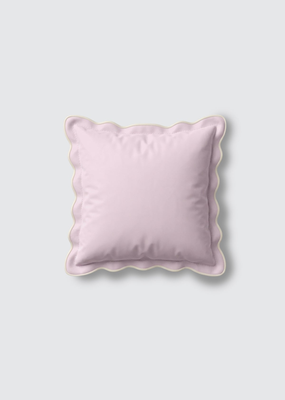 Pink square pillow sham with scalloped edges.