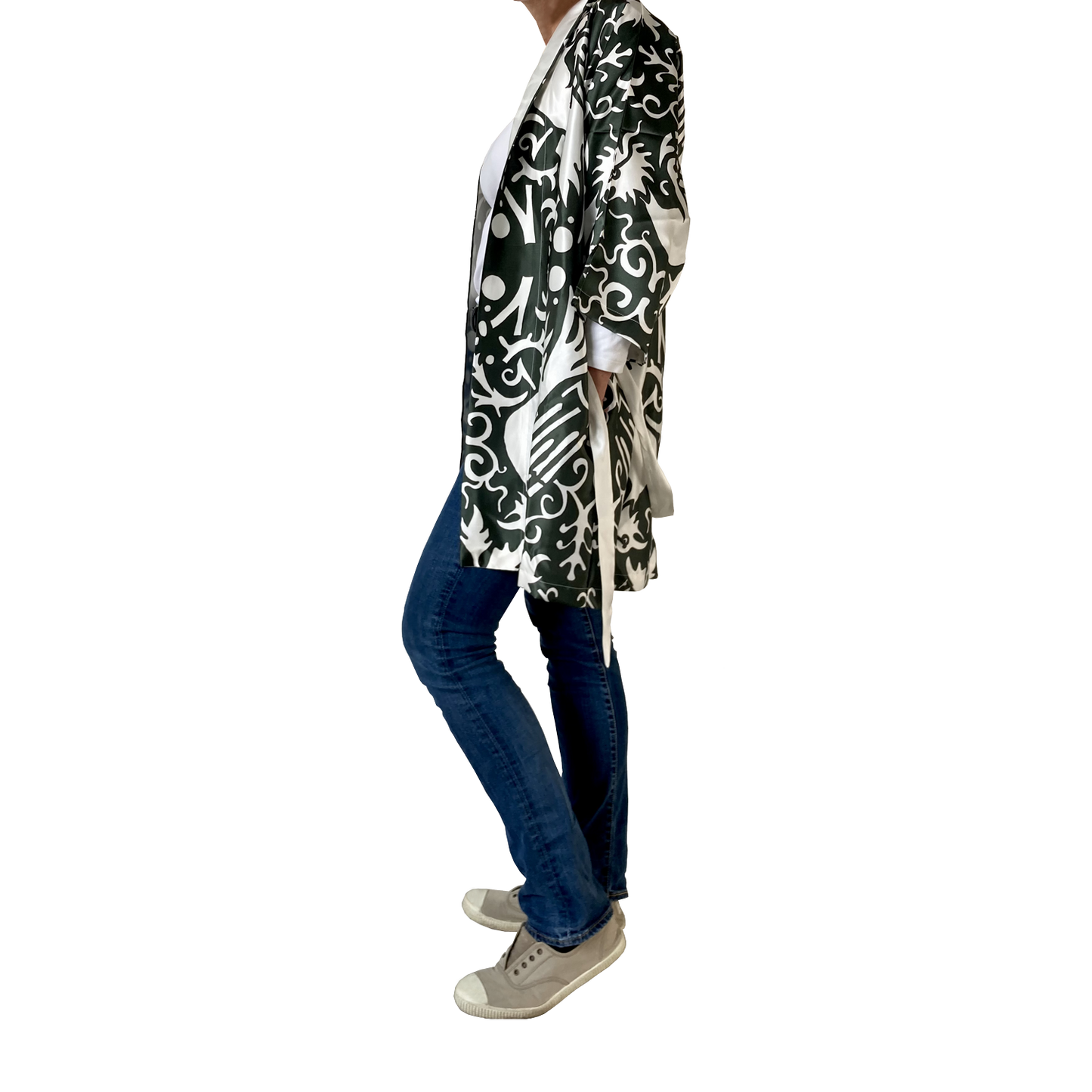 A green and white silk kimono with a phoenix pattern is shown on a model with jeans